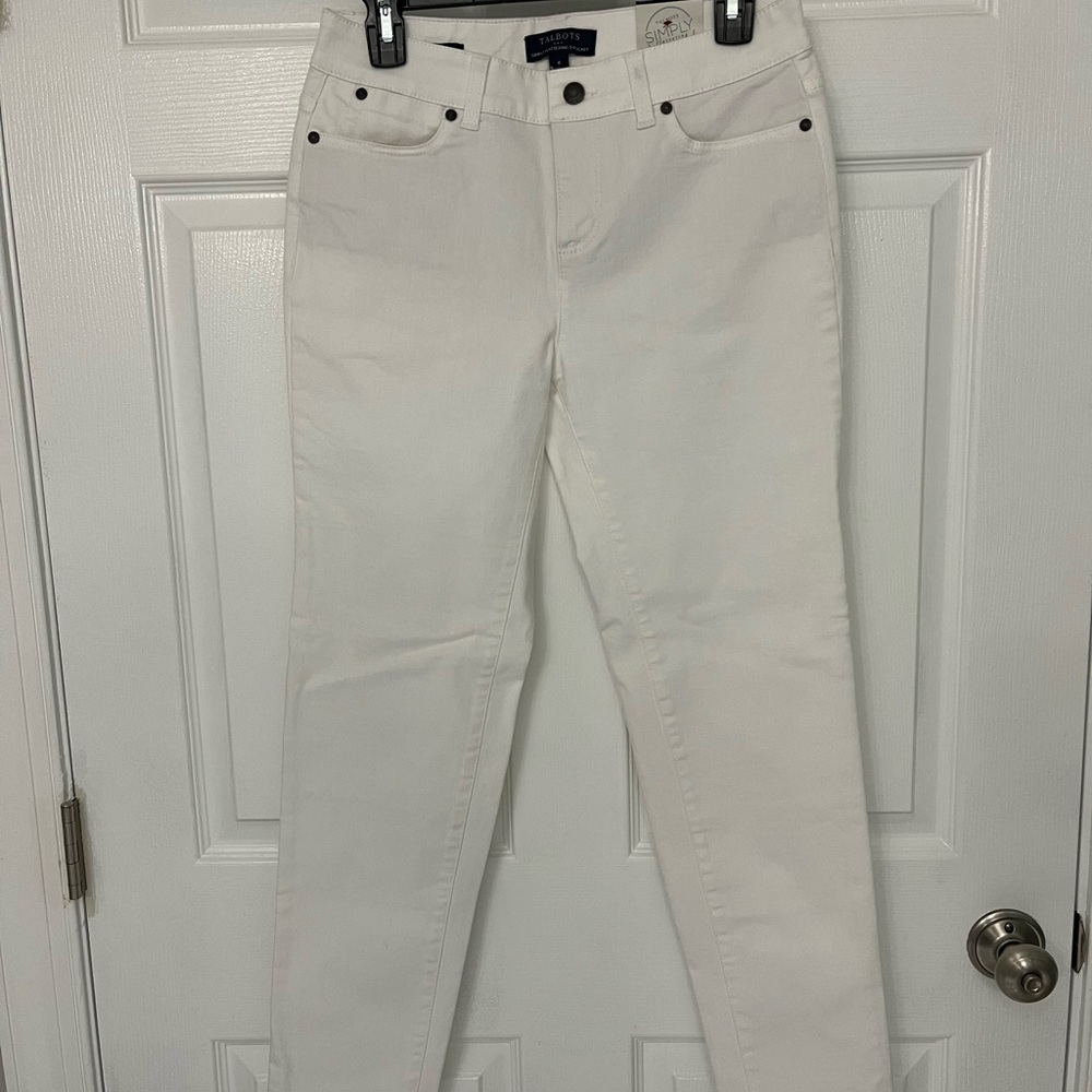New with tags. White denim jeans. Ankle length. Slimming style.